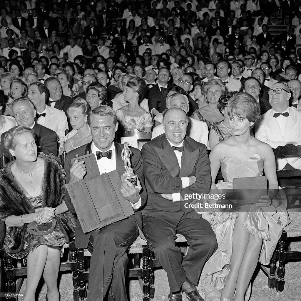 Cary Grant with Carlo Ponti and Sophia Loren