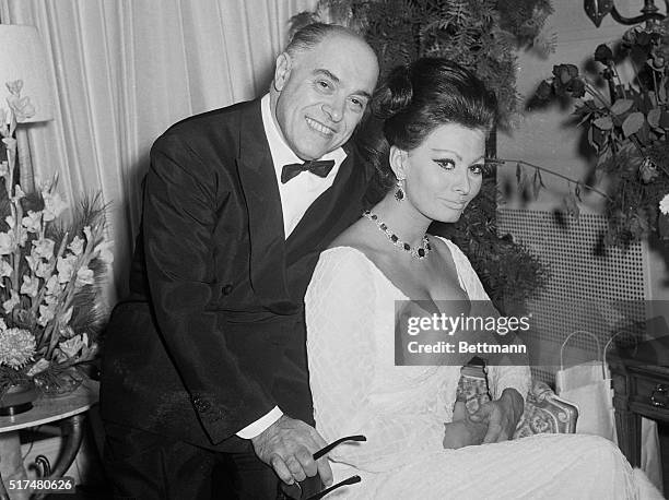 Looking happy before setting out to attend the premiere of "Dr. Zhivago," Italian actress Sophia Loren and producer Carlo Ponti relax at their New...