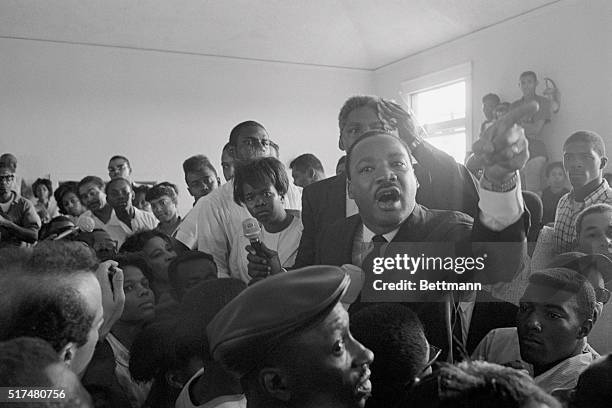 Los Angeles: Dr. Martin Luther King, Jr. Addresses group of Watts district residents August 18 and tells them he is "here to support you because you...