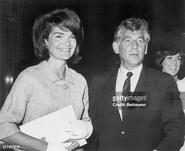 Mrs. Jacqueline Kennedy and New York Philharmonic conductor Leonard Bernstein arrive at the gala invitational preview of Martin Ransohoff's The...