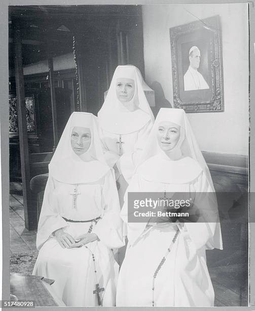 The Singing Nun...The three stars of The Singing Nun pose for a portrait in front of a picture of Pope Paul. They are, left to right, Agnes...