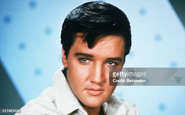 Elvis Presley , American rock 'n' roll legend.