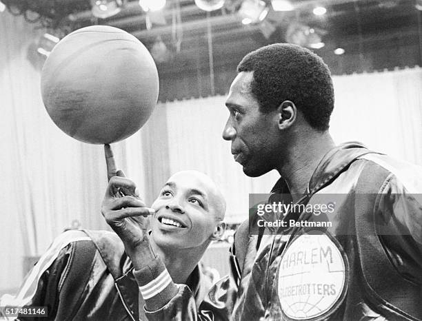 Basketball, Anyone? Fred "Curly" Neal admires Meadowlark Lemon's adroit ball-handling in the CBS Sports special, Harlem Globetrotters: The Road to...