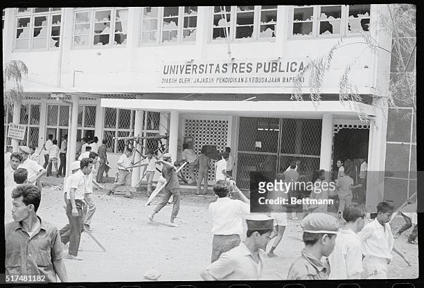 An anti-communist mob attacks the Res Publica University in Jakarta, Indonesia, 12th October 1965. The University is perceived to have Communist ties...