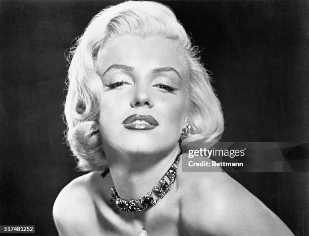 Marilyn Monroe in a strapless dress and a hairstyle favored in the mid 1950s