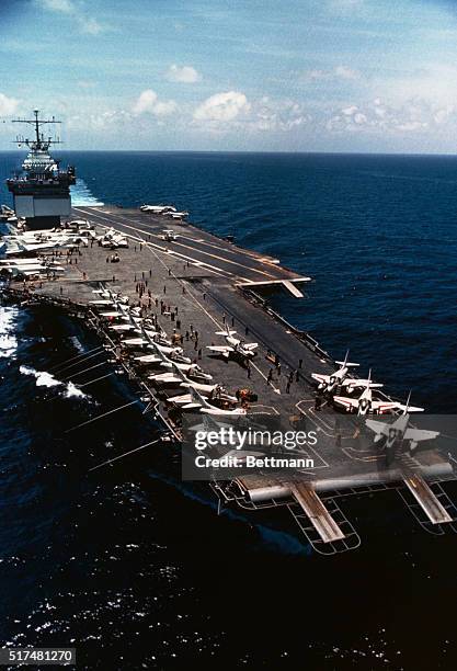 Gulf of Tonkin: Nuclear powered carrier USS Enterprise cruises off shores of Vietnam. A-4 Skyhawk bombers are positioned on deck.