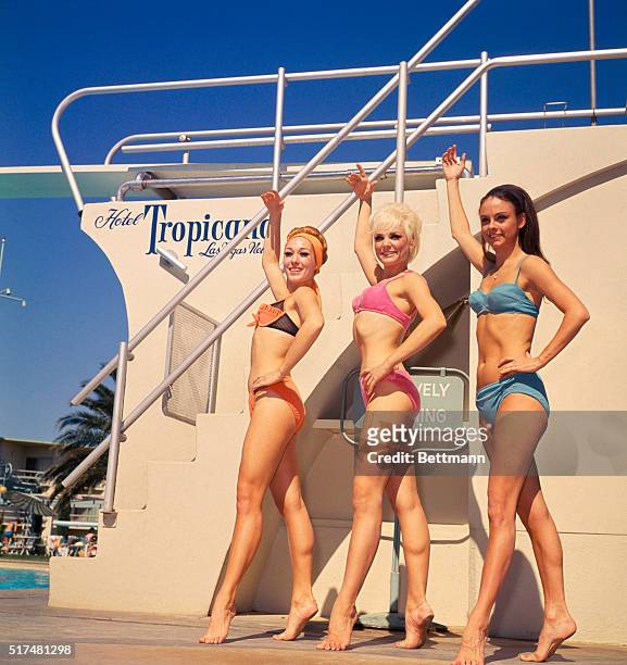 Poolside: the girls, who all dance in the Folies Bergere at the plush Hotel Tropicana, Las Vegas, are: Virginia Justus, the blonde; Lydia Torea, the...