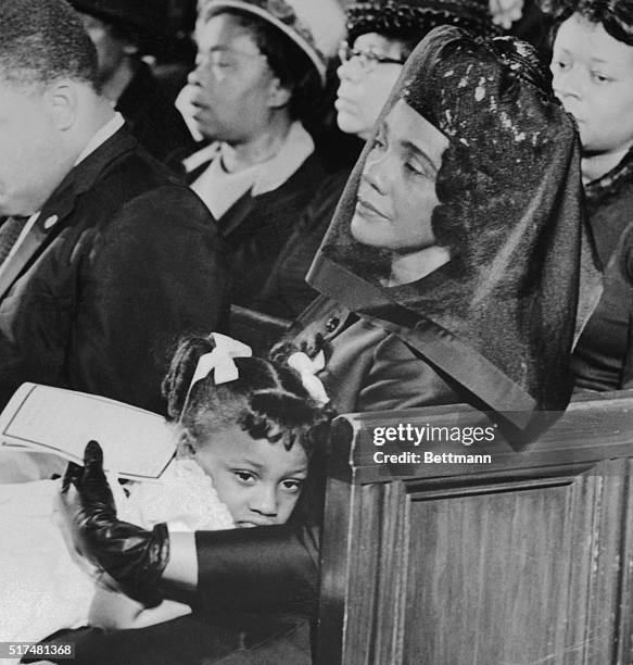 Mrs. Martin Luther King, Jr., comforts her youngest daughter Bernice during services in the Ebenezer Baptist Church, 9th April 1968.