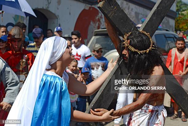 Catholic devotees make a Via Crucis reenactment in Trinidad, Santa Barbara department, 280 km north of Tegucigalpa on March 25, 2016. Christian...