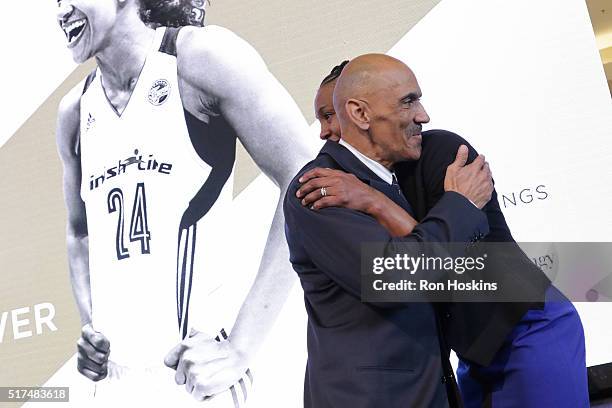 Former NFL Coach, Tony Dungy hugs Tamika Catchings of the Indiana Fever during her Legacy Luncheon at Bankers Life Fieldhouse on March 22, 2016 in...