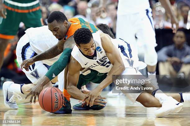 Phil Booth of the Villanova Wildcats and Sheldon McClellan of the Miami Hurricanes battle for a loose ball during the 2016 NCAA Men's Basketball...