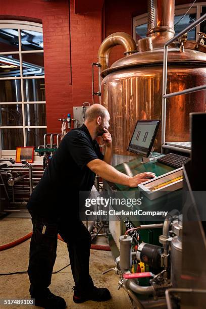 brewmaster at work - mash tun stock pictures, royalty-free photos & images