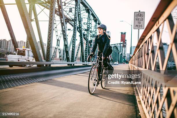 bike commuter in portland oregon - portland - oregon stock pictures, royalty-free photos & images