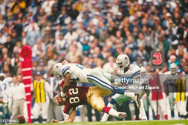 Dallas Cowboys defensive back Tony Dixon lays out tight end Eric Johnson during a 31 to 27 loss to the San Francisco 49ers on .