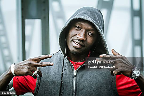 young rapper on iron bridge - rapper isolated stock pictures, royalty-free photos & images