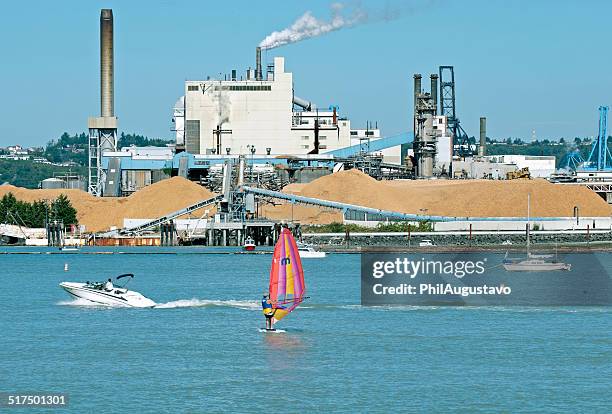 windsurfer on water near paper mill in tacoma wa - stop the pulp mill stock pictures, royalty-free photos & images