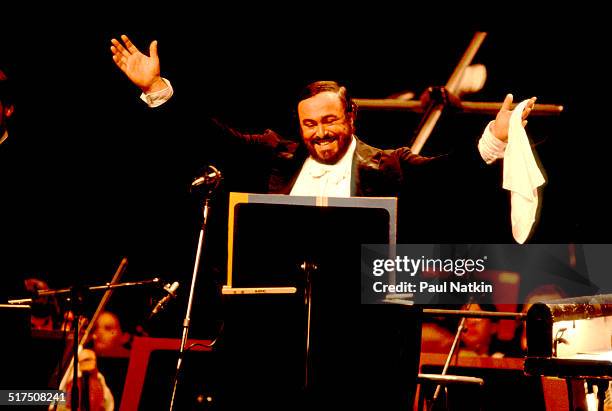 Italian tenor Luciano Pavarotti performs onstage at the Poplar Creek Music Theater, Hoffman Estates, Illinois, August 13, 1984.