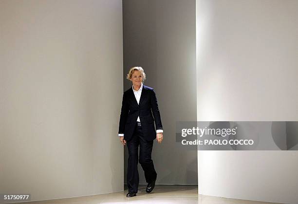 File picture taken 01 October 2004 shows German designer Jil Sander appearing on the catwalk at the end of the presentation of her Spring/Summer 2005...