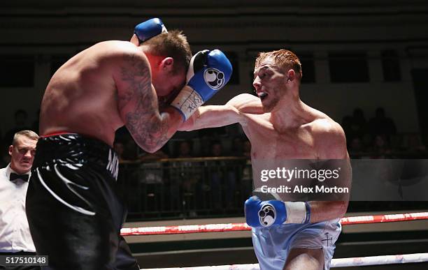 Tom Baker lands a right on Jack Morris during the English Light-Heavyweight Championship fight between Tom Baker and Jack Morris at York Hall on...