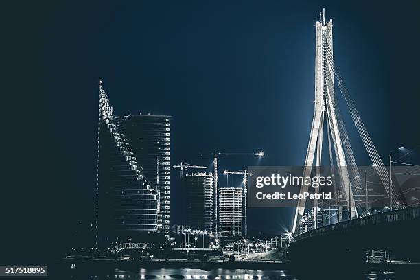 riga riverbank and modern buildings - riga stockfoto's en -beelden