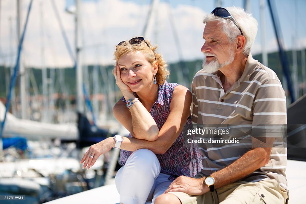 Senior couple relaxing on yacht