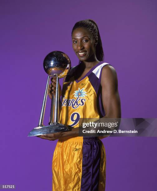 Lisa Leslie of the Los Angeles Sparks poses with her WNBA World Championship Trophy during Los Angeles Sparks Media Day in Los Angeles, California on...