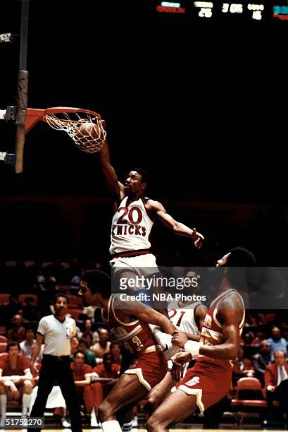 Micheal Ray Richardson of the New York Knicks goes up for a slam dunk against the Cleveland Cavaliers during a NBA game circa 1980 at Madison Square...