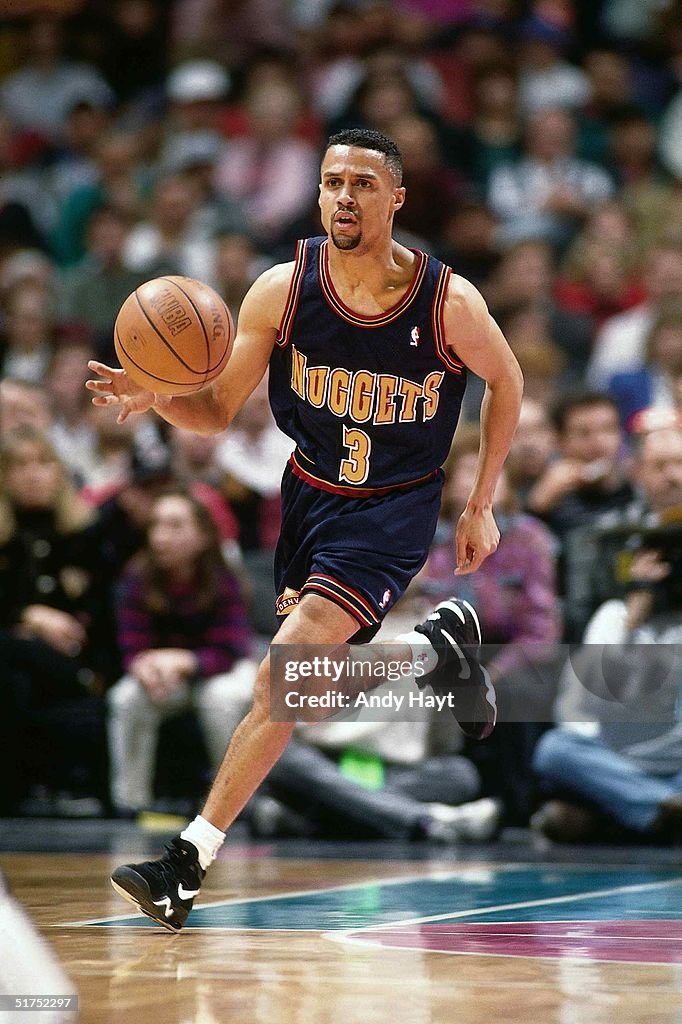 Mahmoud Abdul-Rauf of the Denver Nuggets moves the ball against the ...