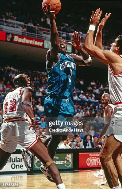 Larry Johnson of the Charlotte Hornets drives to the basket for a layup against the Miami Heat during the NBA game on November 27, 1993 in Miami,...