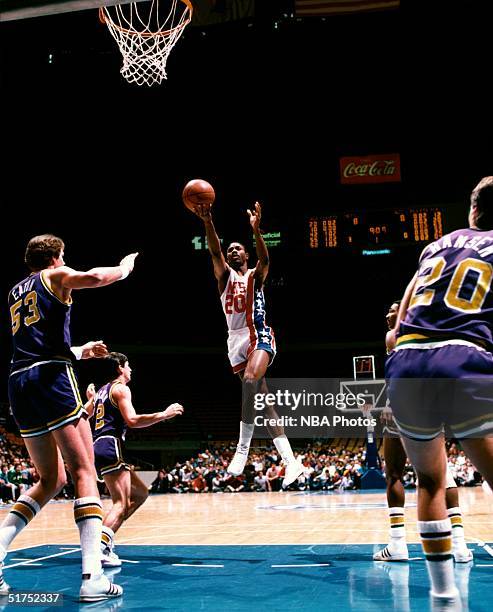 Micheal Ray Richardson of the New Jersey Nets drives to the basket against the Utah Jazz during the NBA game circa 1982 at the Brendan Byrne Arena in...