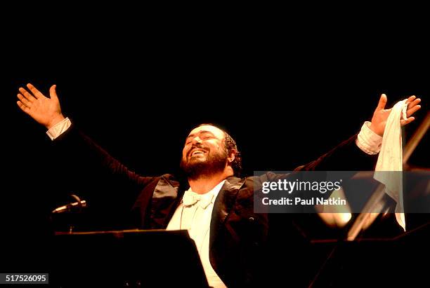 Italian tenor Luciano Pavarotti performs onstage at the Poplar Creek Music Theater, Hoffman Estates, Illinois, August 13, 1984.