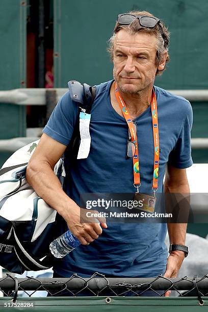 Mats Wilander of Sweden leaves the court after watching Madison Keys play Kirsten Flipkens of Belgium during the Miami Open presented by Itau at...