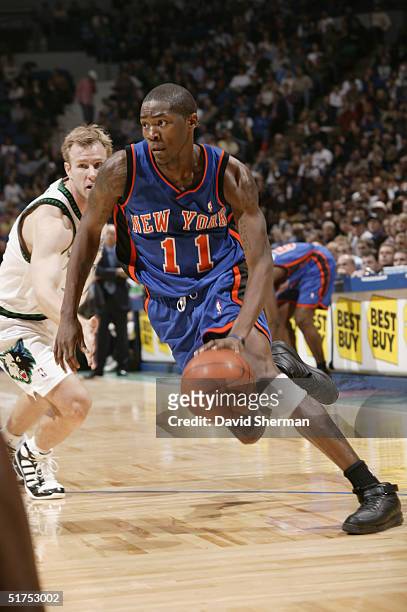 Jamal Crawford of the New York Knicks drives around Fred Hoiberg of the Minnesota Timberwolves during the game at Target Center on November 3, 2004...
