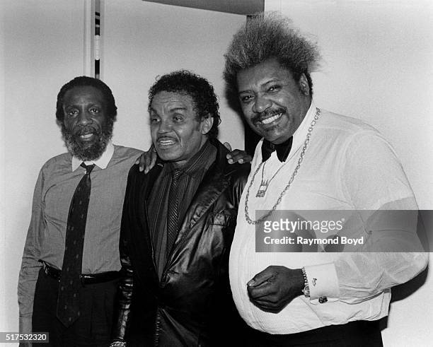 Comedian Dick Gregory , Joe Jackson and boxing promoter Don King poses for photos during The Jacksons 'Victory Tour' pre-party at The Whitehall Hotel...