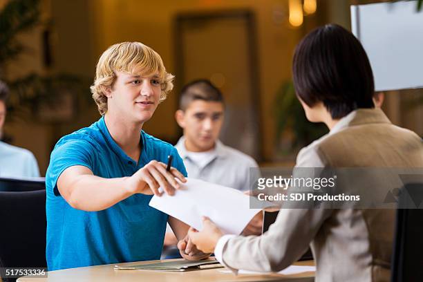 college student interviews at job fair - job fair stock pictures, royalty-free photos & images