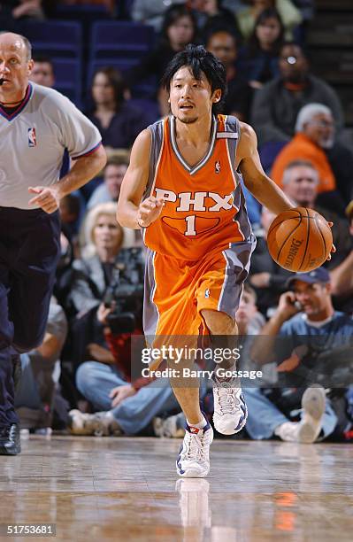 Yuta Tabuse of the Phoenix Suns dribbles the ball against the Atlanta Hawks during the game at America West Arena on November 3, 2004 in Phoenix,...