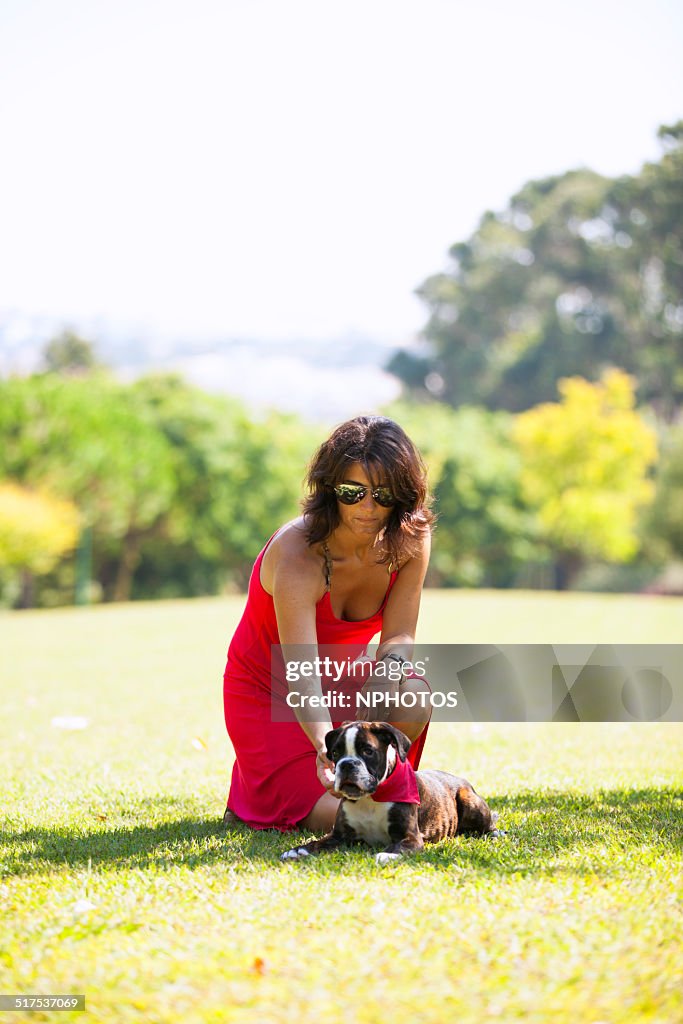 Woman with a puppy boxer dog