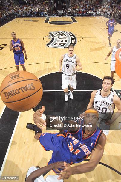 Jerome Williams of the New York Knicks drives to the basket against the San Antonio Spurs at the SBC Center on November 16, 2004 in San Antonio,...