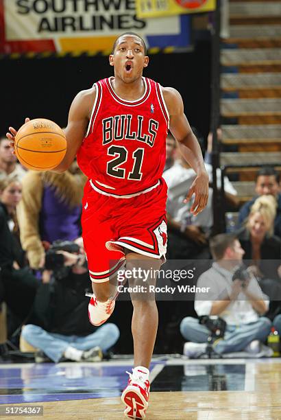 Chris Duhon of the Chicago Bulls dribbles the ball down the court against the Sacramento Kings on November 16, 2004 at Arco Arena in Sacramento,...