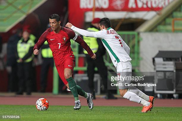 Portuguese forward Cristiano Ronaldo vies with Bulgaria midfielder Mihail Aleksandrov during the match between Portugal and Bulgaria Friendly...
