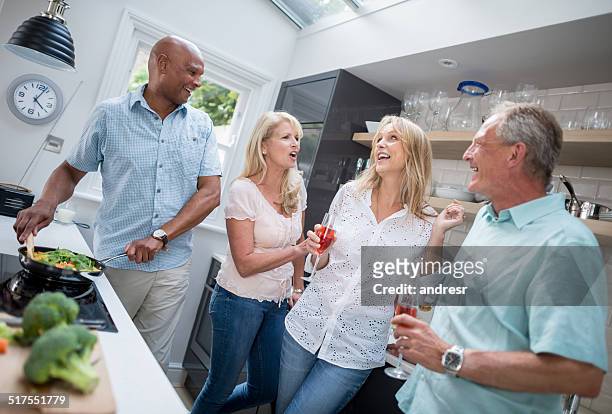 friends having dinner - house warming stock pictures, royalty-free photos & images