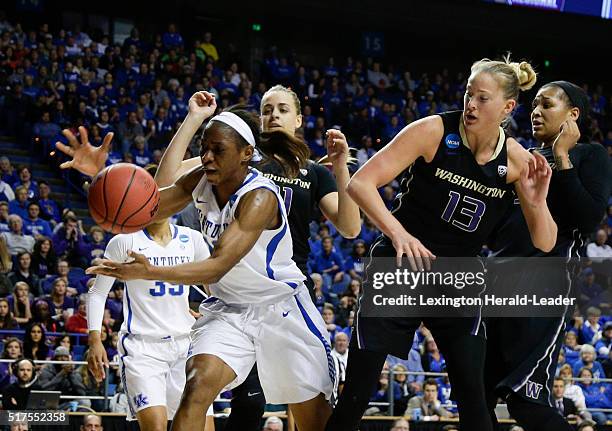 Kentucky's Evelyn Akhator, left, pulls in a loose ball in front of Washington's Katie Collier in the third round of the NCAA Tournament on Friday,...