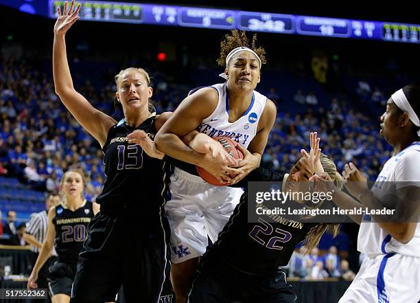 Kentucky's Alexis Jennings, middle, pulls down a rebound between Washington's Katie Collier and Alexus Atchley in the third round of the NCAA...