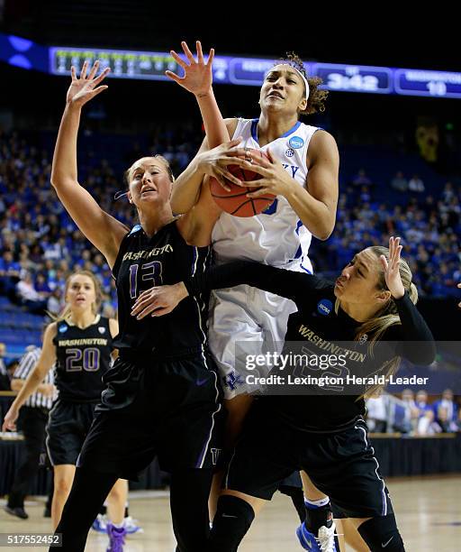 Kentucky's Alexis Jennings, middle, pulls down a rebound between Washington's Katie Collier and Alexus Atchley in the third round of the NCAA...