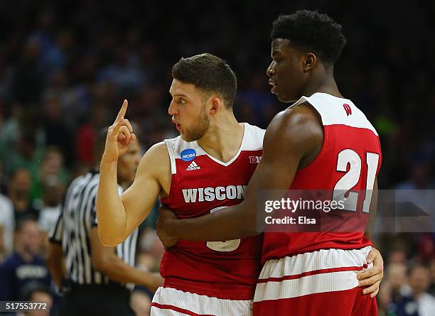Zak Showalter of the Wisconsin Badgers reacts with teammate Khalil Iverson in the second half against the Notre Dame Fighting Irish during the 2016...
