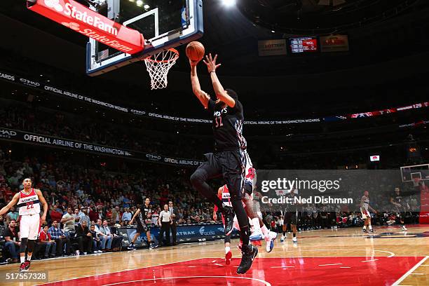 Karl-Anthony Towns of the Minnesota Timberwolves shoots the game winning shot against the Washington Wizards on March 25, 2016 at Verizon Center in...