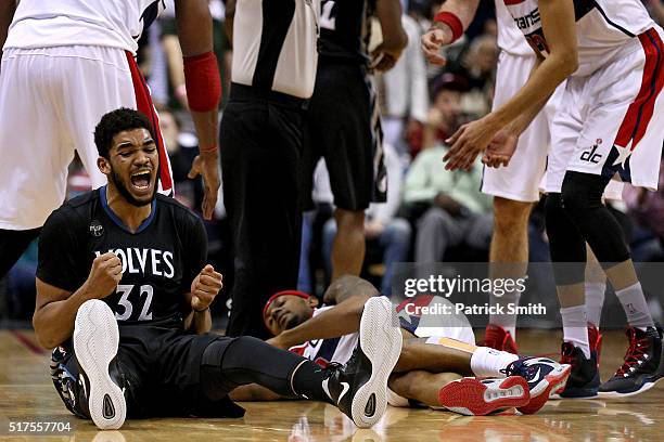 Karl-Anthony Towns of the Minnesota Timberwolves reacts in the first overtime against the Washington Wizards at Verizon Center on March 25, 2016 in...