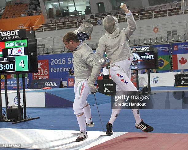In this handout image provided by the FIE, Nikolas Iliasz of Hungary and Kang Minkyu of Korea compete during the individual Men's Sabre match during...