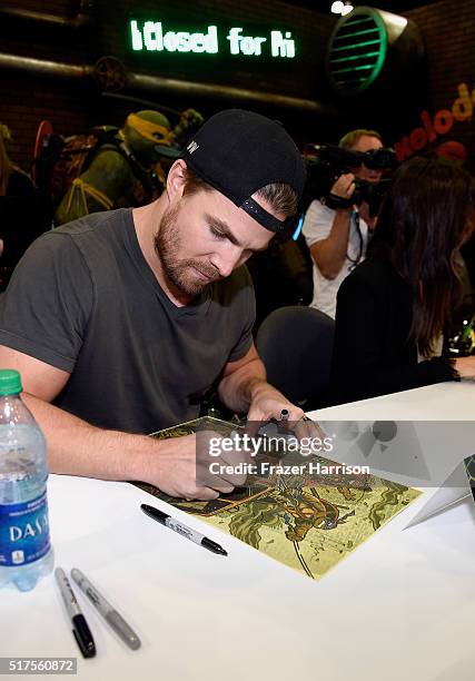 Actor Stehen Amell attends a autograph signing at WonderCon 2016 to promote the upcoming release of Paramount Pictures' Teenage Mutant Ninja Turtles...