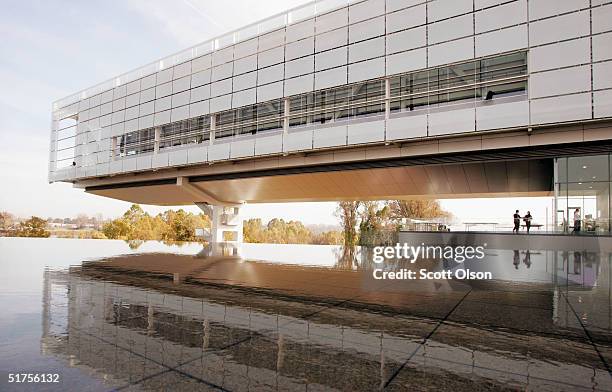People stand at the William J. Clinton Presidential Library November 17, 2004 in Little Rock, Arkansas. Little Rock will host the opening ceremony...